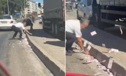 İzmir Ayrancılar'da para dolu çuval yola düştü, banknotlar yola savruldu