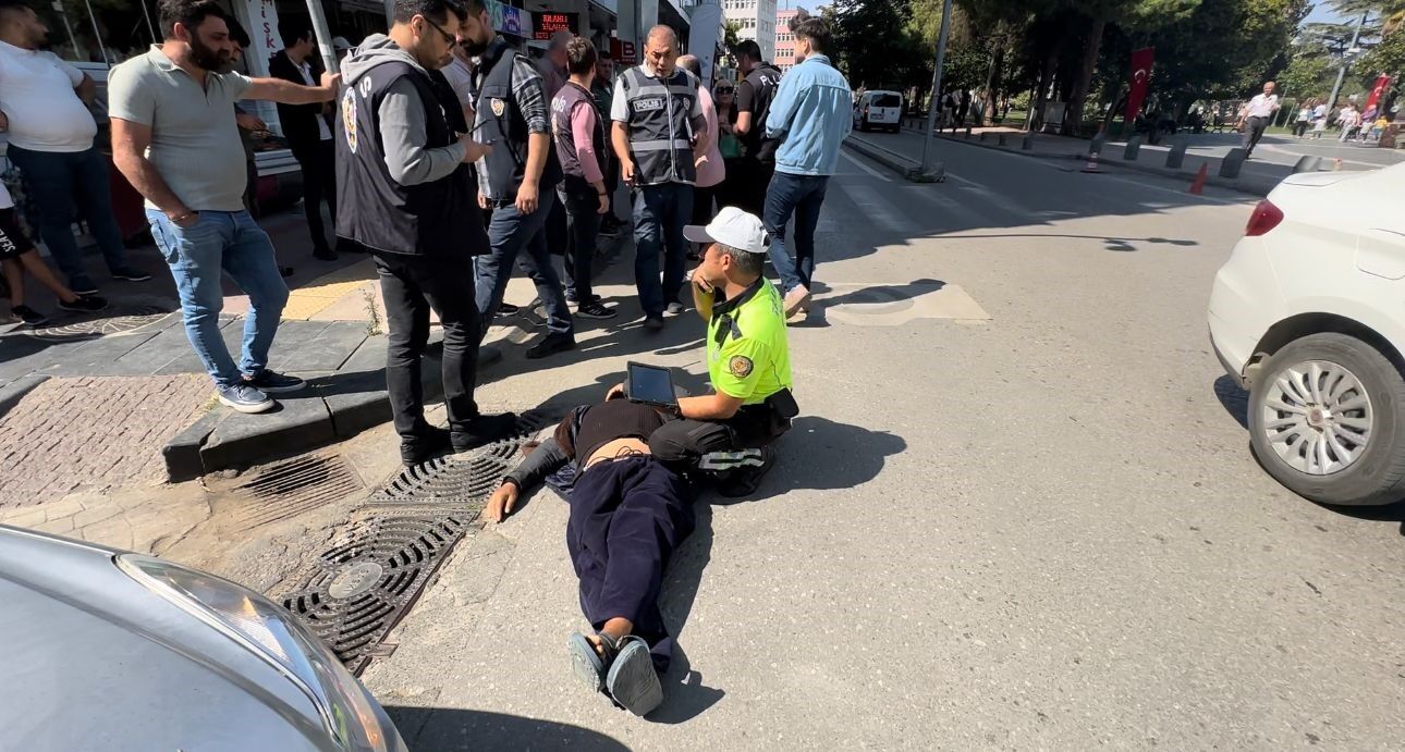 Alkollü şahıs, aracın önünden geçerken bir anda kendini yere bıraktı-1